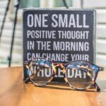 Photo by Binti Malu: https://www.pexels.com/photo/photo-of-a-sign-and-eyeglasses-on-table-1485657/ Cultivating a Positive Mindset