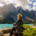 Photo by Andre Furtado: https://www.pexels.com/photo/a-woman-sits-on-a-rock-beside-the-lake-2916820/